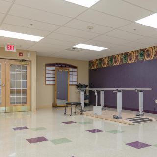 A spacious training room with fitness equipment and a clean, organized layout.