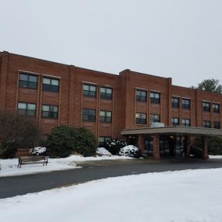 A brick building covered in snow during winter.