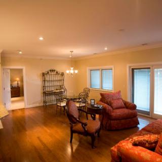 A cozy and inviting living room featuring elegant furniture and warm lighting.