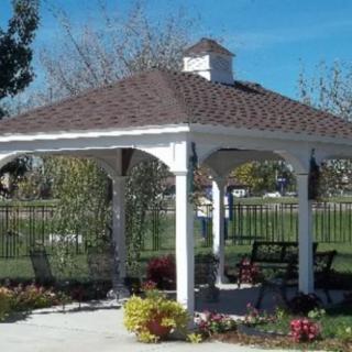 A scenic outdoor gazebo in a garden setting.