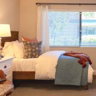 Cozy bedroom with warm lighting and stylish decor.