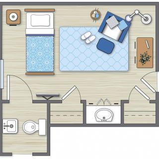 A floor plan featuring a bedroom with adjacent bathroom and furnishing details.