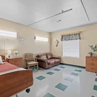 A comfortable and well-lit hospital room designed for patient care.