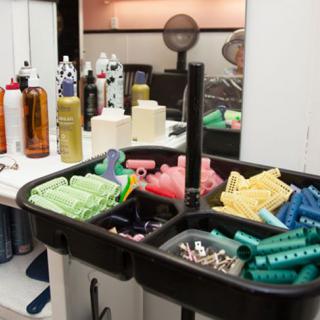 A hair salon setup with various styling tools and hair products on display.