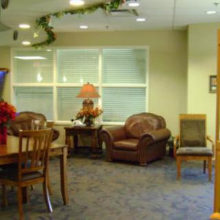 A cozy waiting area with comfortable seating and warm decor.