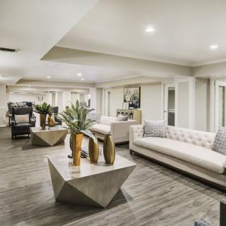 A modern living room with elegant furniture and stylish decor.