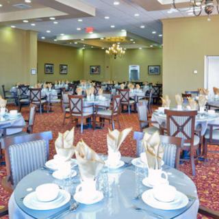 An elegant dining area with tables neatly set for guests.