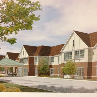 A rendering of a modern residential building with well-designed architecture and landscaping.
