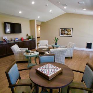 A modern living room with comfortable seating and a television.