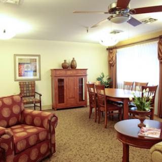 A cozy and well-furnished living space featuring a dining area, comfortable seating, and tasteful decor.