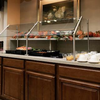 A well-organized buffet with various food options displayed on the counter.