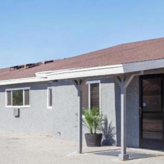 A simple suburban house exterior on a sunny day.