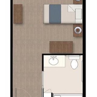 A simple floor plan of a bedroom with an adjoining bathroom.