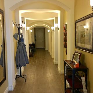 A beautifully designed hallway featuring warm lighting and stylish decor.