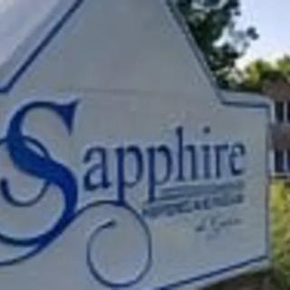 A sign for Sapphire, located outdoors near a building.