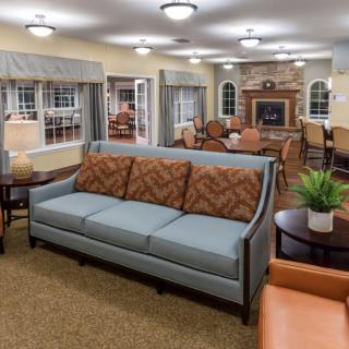 A cozy living room with comfortable seating and a fireplace.