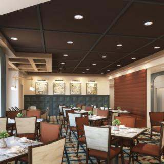 A modern restaurant interior with neatly arranged tables and chairs.