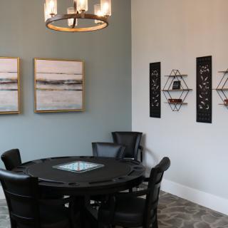 A modern dining room with elegant decor and a stylish round table.