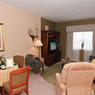 A cozy living room with comfortable seating and a television.