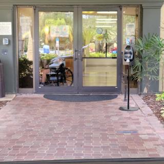 Main entrance with accessibility features and a welcoming pathway.