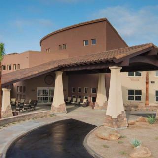 A modern building with a large entrance and unique architectural design.