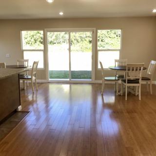 Spacious dining area with hardwood floors and abundant natural light.
