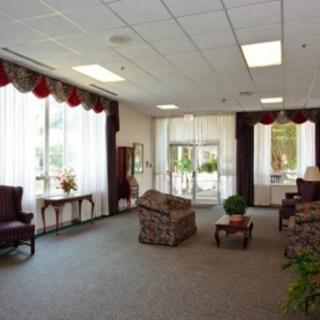 A spacious lobby area with comfortable seating and large windows.