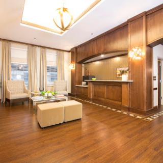 A stylish and modern lobby featuring wooden accents and contemporary furniture.
