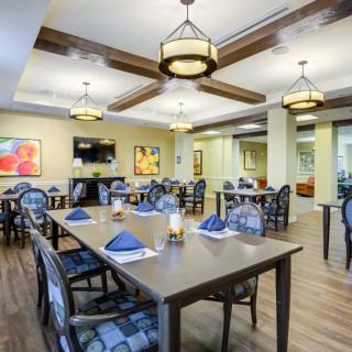 A spacious and elegantly designed dining area with modern furnishings.
