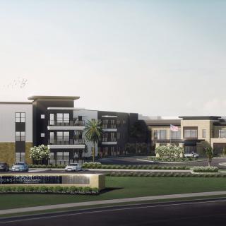 A modern apartment complex with contemporary design features, surrounded by landscaped greenery.