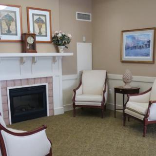A cozy living room with a fireplace and comfortable seating.