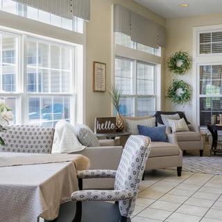 Bright and cozy living room with comfortable seating and large windows.
