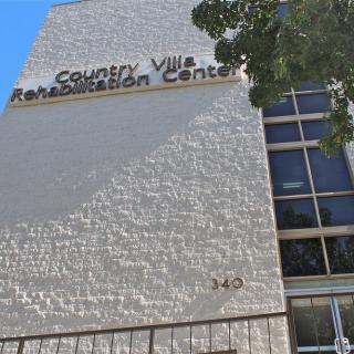 The exterior of Country Villa Rehabilitation Center with visible signage during the daytime.