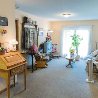 A cozy living room with vintage decor and natural lighting.
