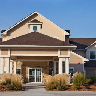 A modern suburban house with a prominent entrance.