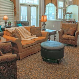 A cozy living room with comfortable seating and warm lighting.