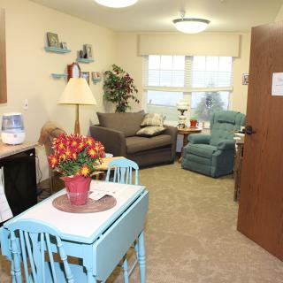 A cozy living room with comfortable seating and vibrant decor.