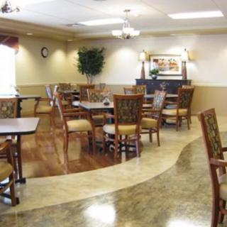 An elegant indoor dining area with neatly arranged tables and chairs.