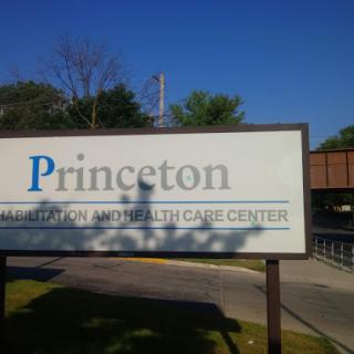 Sign for the Princeton Health Care Center on a clear day.