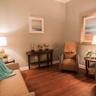 A warm and inviting living room with comfortable seating and soft lighting.