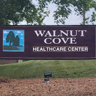 Sign for Walnut Cove Healthcare Center, indicating a healthcare facility.