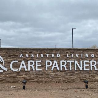 Sign for Care Partners Assisted Living facility outdoors.