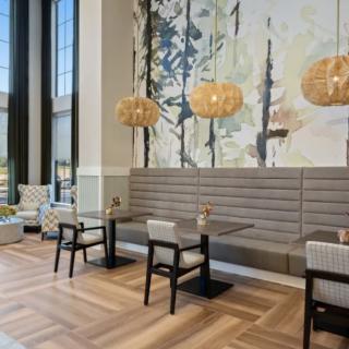 A modern restaurant interior with elegant decor and seating arrangement.