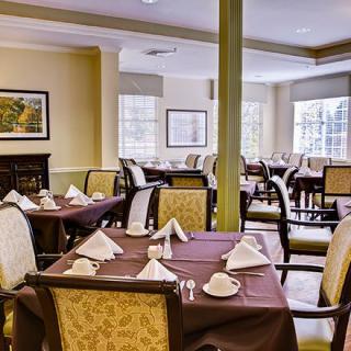 A well-appointed dining area with neatly arranged tables and chairs.
