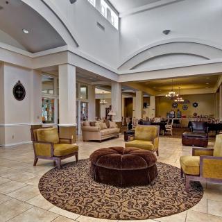 A spacious and elegantly designed hotel lobby featuring comfortable seating and modern dcor.
