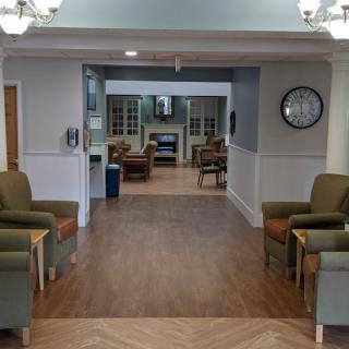 A cozy lounge area with comfortable seating and warm lighting.