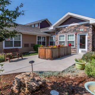 A suburban house with a landscaped front yard and garden.