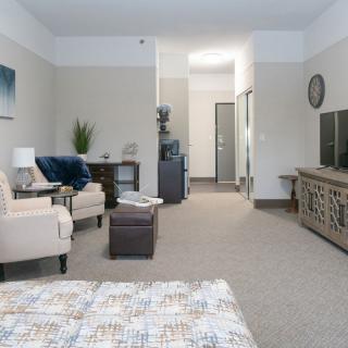 A modern and cozy living room with stylish furniture and decor.