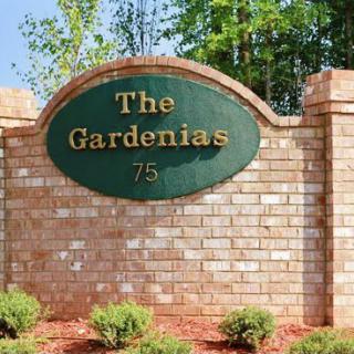 Entrance sign for 'The Gardenias' community.