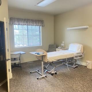 A well-lit and spacious patient room in a healthcare facility.